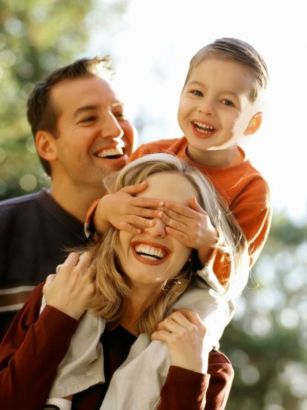 happy family playing together outside