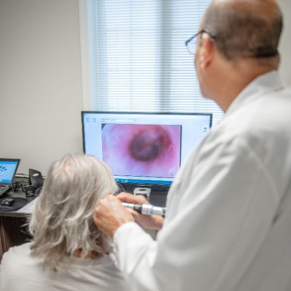 specialist using a video otoscope