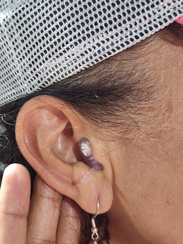 woman wearing custom hearing protection